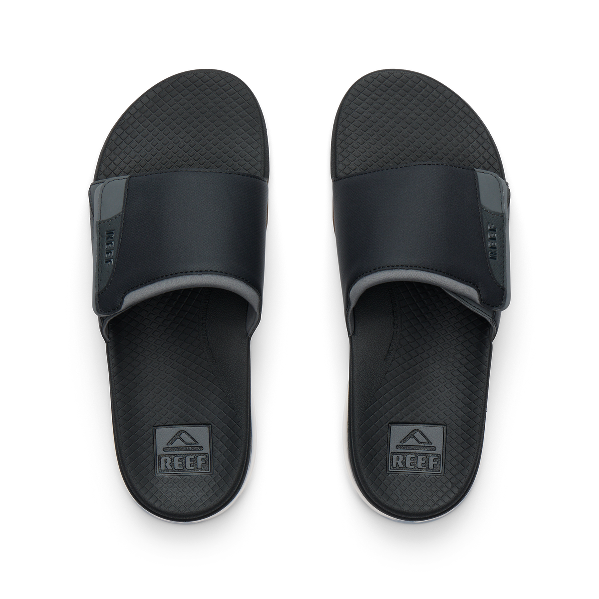 Pair of Fanning + Slide men's black water-friendly slides overhead, soft cushioned footbeds with anatomical arch support.