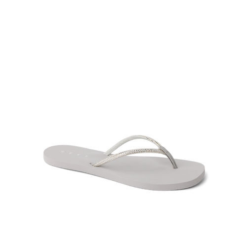 Bliss Bling Fling women's sandal facing left, close-up of cushioned sole and silver straps for beach comfort