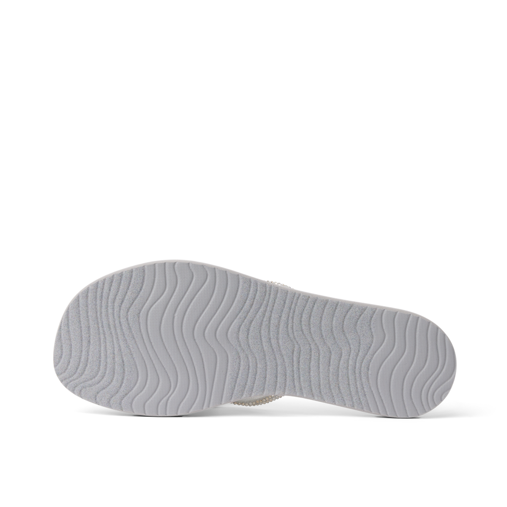 Bliss Bling Fling showing bottom sole facing up, lightweight durable sandal with surf-inspired wave tread for everyday comfort
