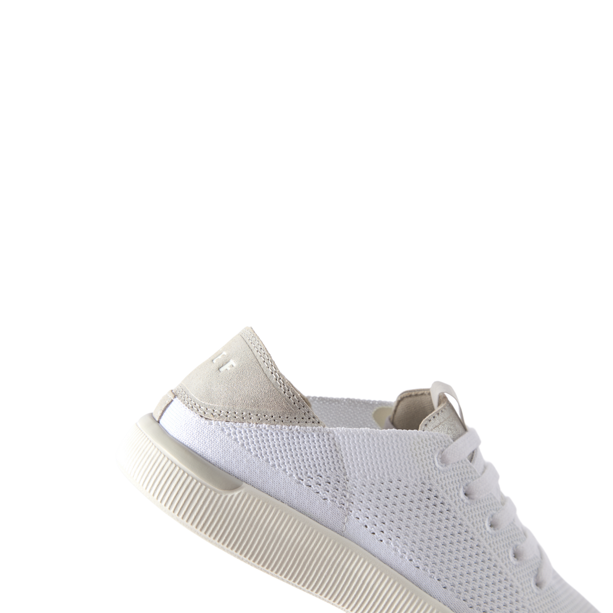 Reef Neptune white sneaker facing right, close-up of lightweight mesh upper and cushioned sole for comfort.