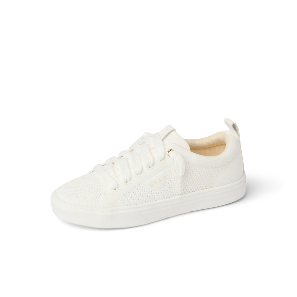 Lay Day Lite women’s white sneaker facing left, knit upper, lightweight, breathable, comfort-focused design.