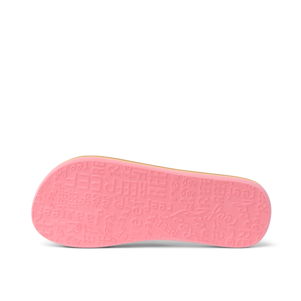 Kids Ahi pink outsole facing up, close-up of water-friendly, durable sole with embossed REEF logo and patterns