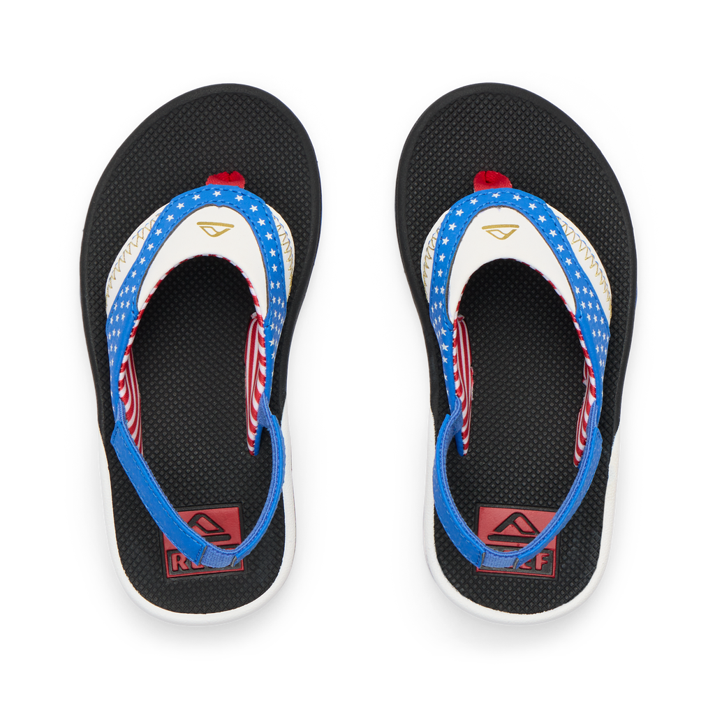 Little Fanning boys' sandals top view with blue, white, and red straps, featuring comfy arch support and soft cushioning.