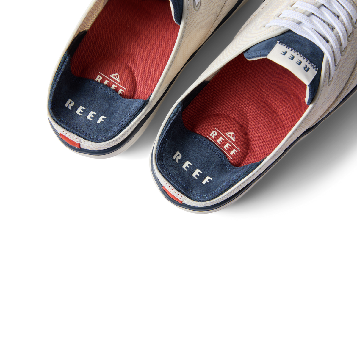 Top view close-up of Neptune Lido men's shoes showing red cushioned insoles, navy heel area, and white laces facing upward.