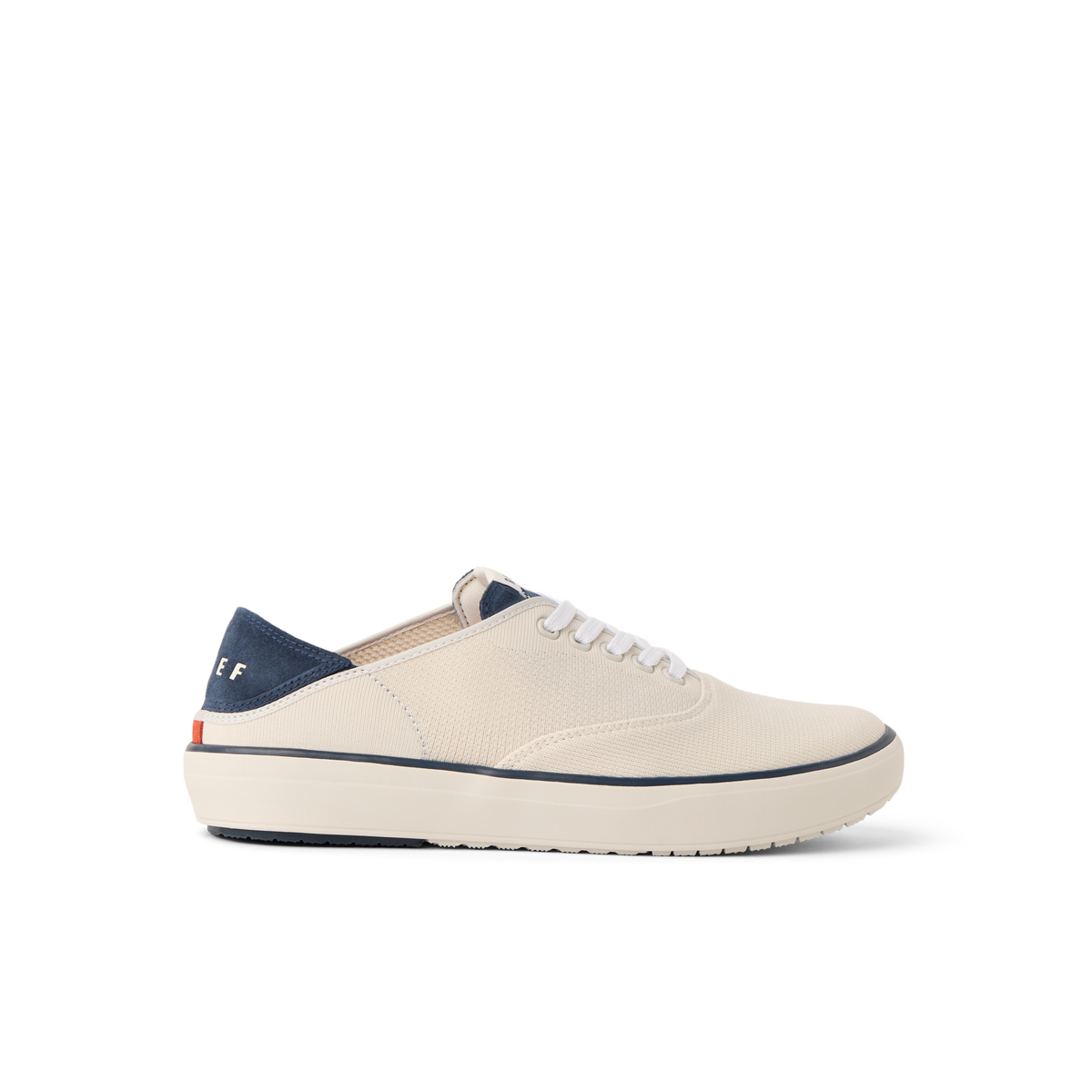 Neptune Lido men's sneaker facing left, tan and navy, beach-inspired comfort with arch support and cushioning.
