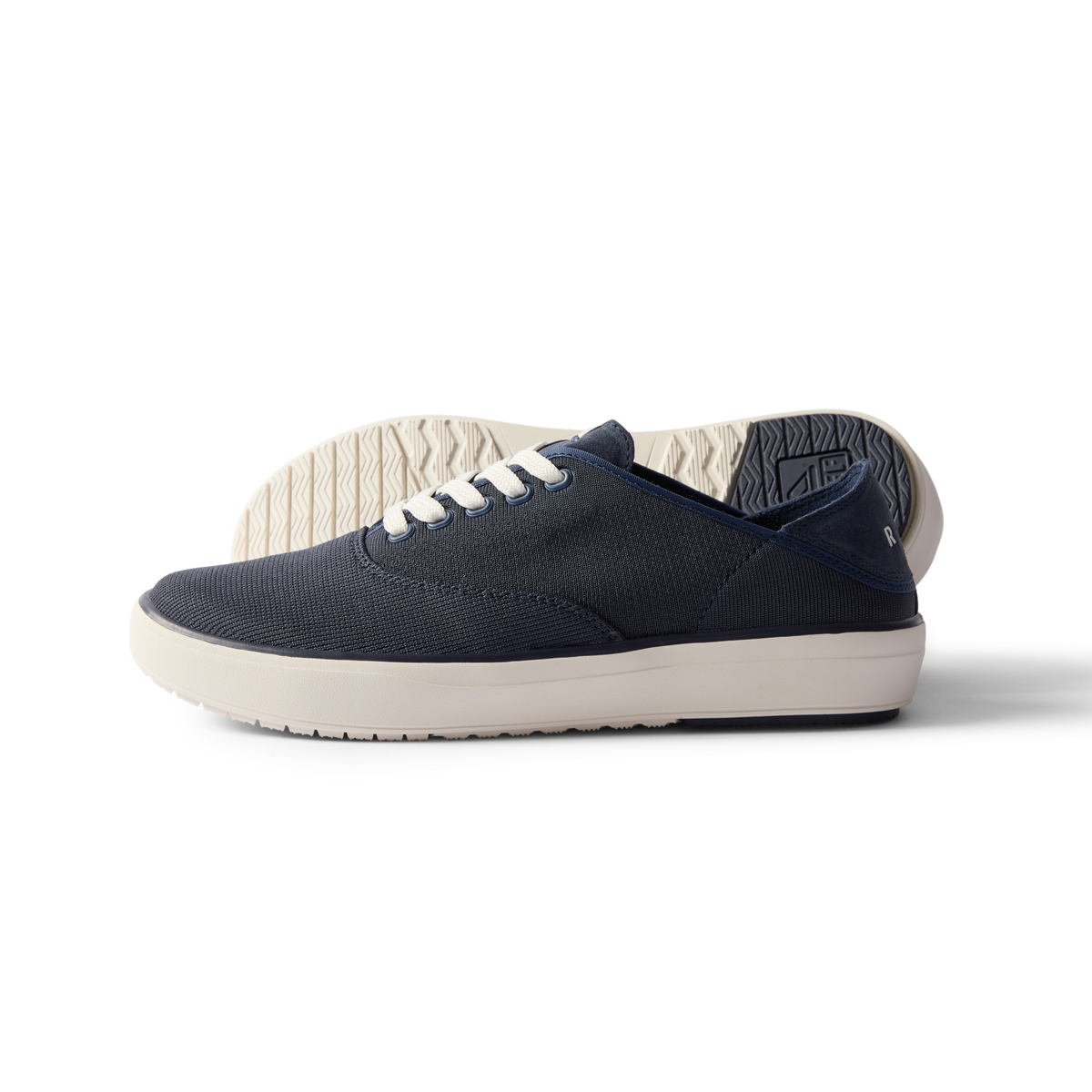 Side view of navy Neptune Lido men's sneaker with white sole, surf-inspired comfort and anatomical arch support.