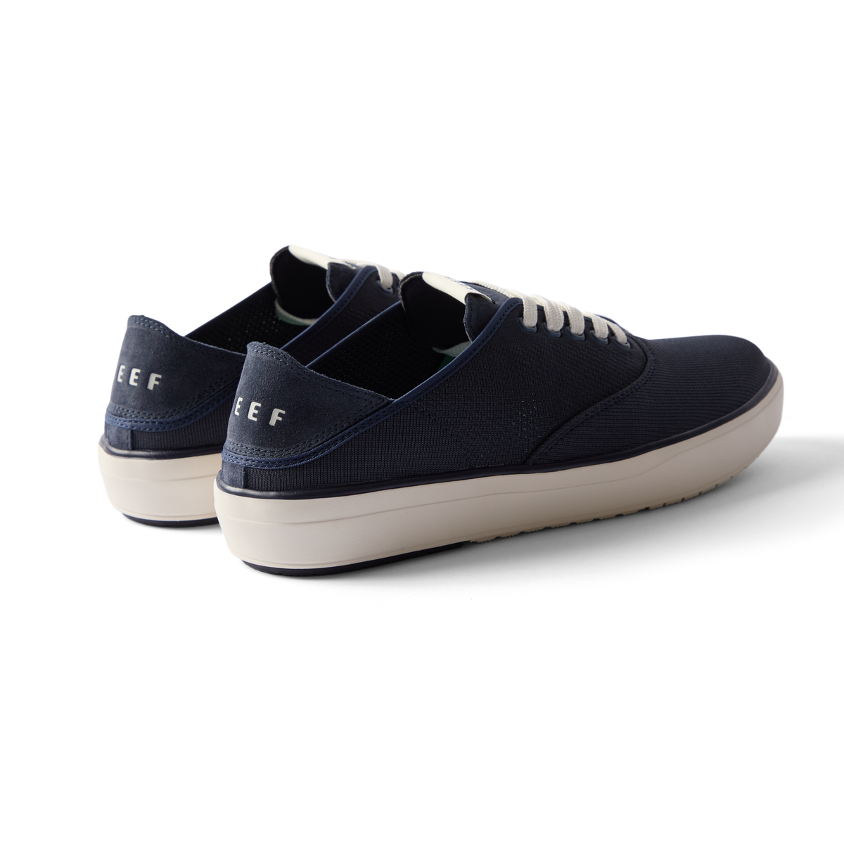 Neptune Lido navy sneakers facing left showing heel and side, surf-inspired comfort with anatomical arch support and cushioning.