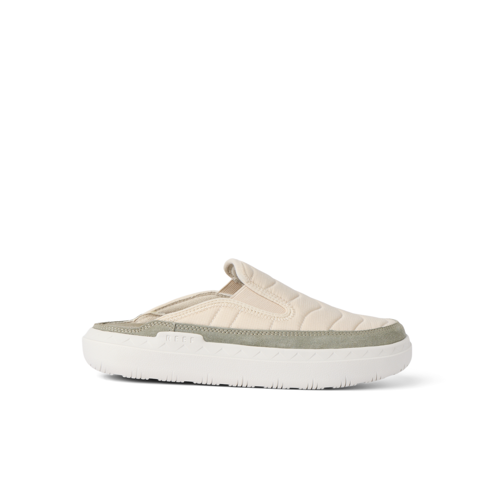 Rambler Kicker mule facing right with soft oatmeal upper, cushioned memory foam footbed, and lightweight white EVA sole for comfort