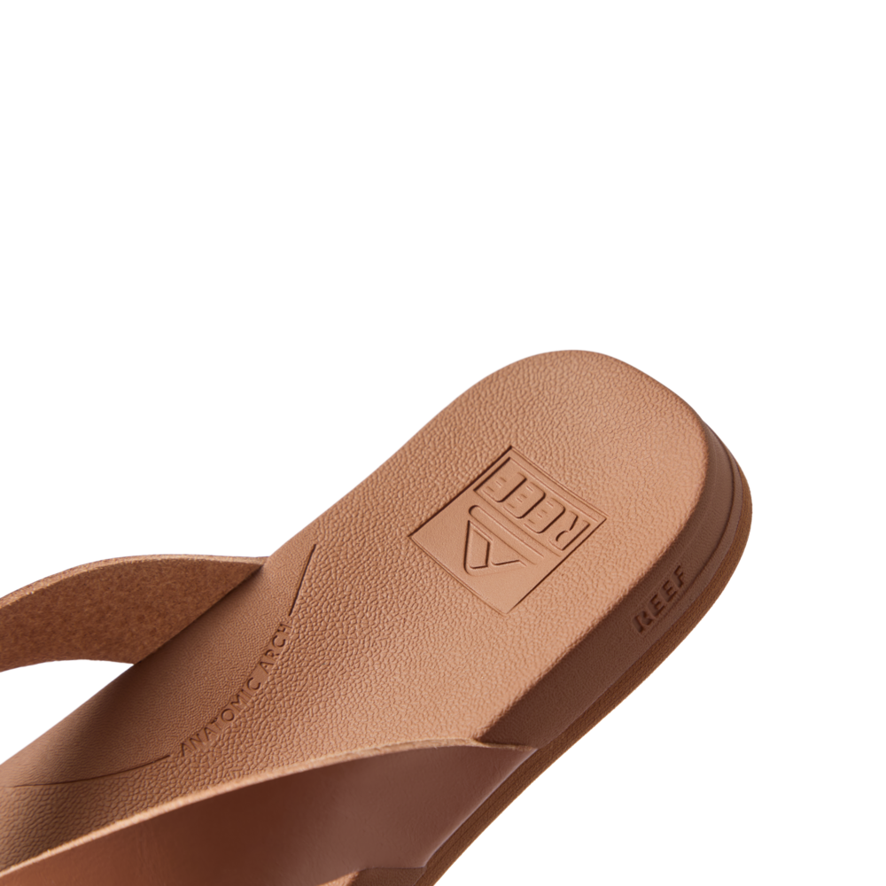 Close-up of the front right side of the tan Vista Lune sandal showing soft-rebound cushioning and anatomical arch support.