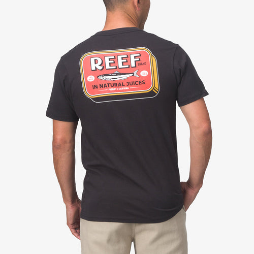 Back view of a man wearing the black Cannery Tee with colorful REEF graphic, showcasing beach-inspired, comfortable apparel.