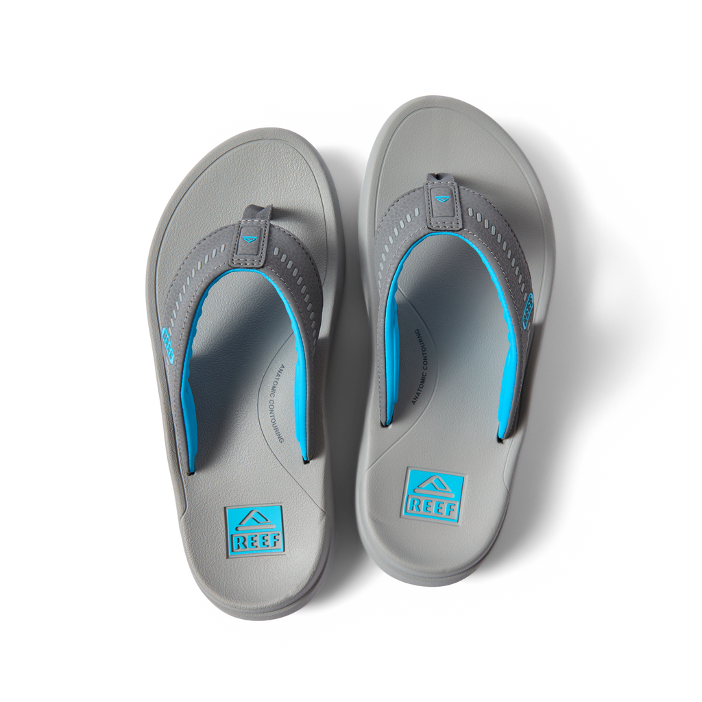 Top view of Cruiser men's grey and aqua flip flops with anatomical arch support and soft cushioning for beach comfort