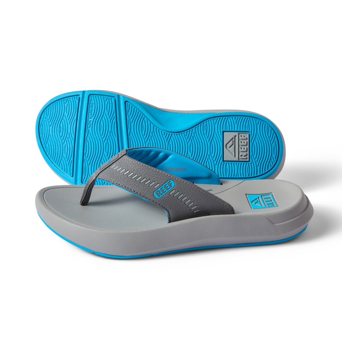 Cruiser men's flip flops in charcoal and aqua, right side facing, showing sole and cushioned footbed with arch support.