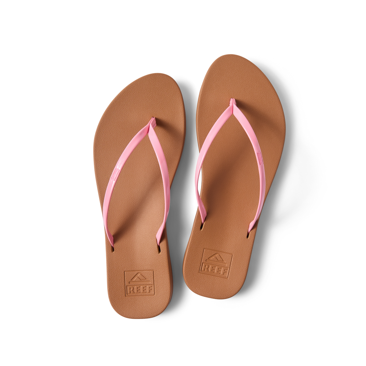 Top view of Cushion Slim women's flip flops with pink straps and brown cushioned footbeds, designed for beach comfort and support.