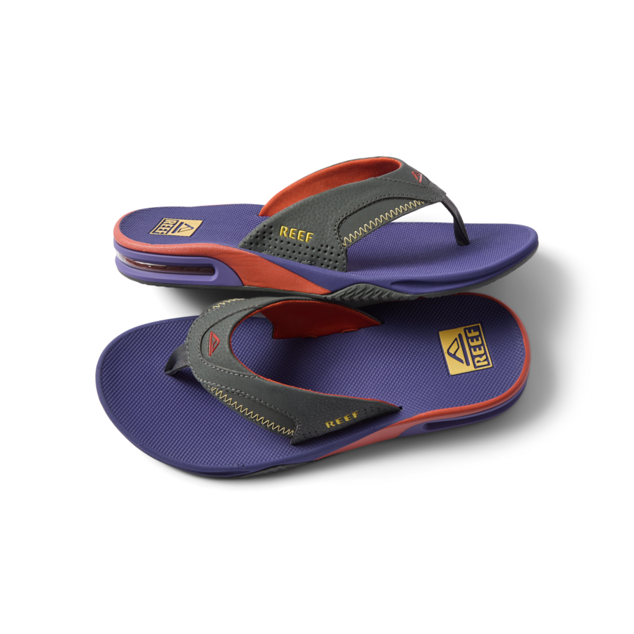 Fanning men's sandals showing top and side views, purple footbed with gray and orange straps, beach-inspired comfort design.