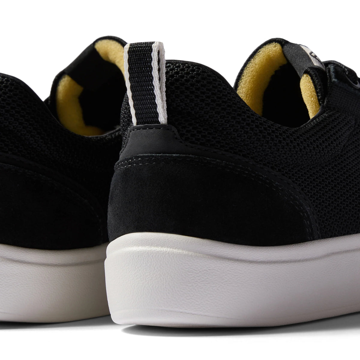 Close-up of the heel of the Triton men's shoe facing backwards, featuring surf-inspired comfort and durable design.