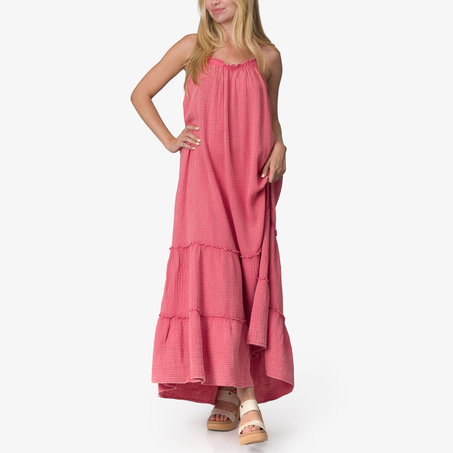 Woman wearing a pink Lainey Maxi Dress with platform sandals facing forward, showcasing comfort and beach-inspired style.