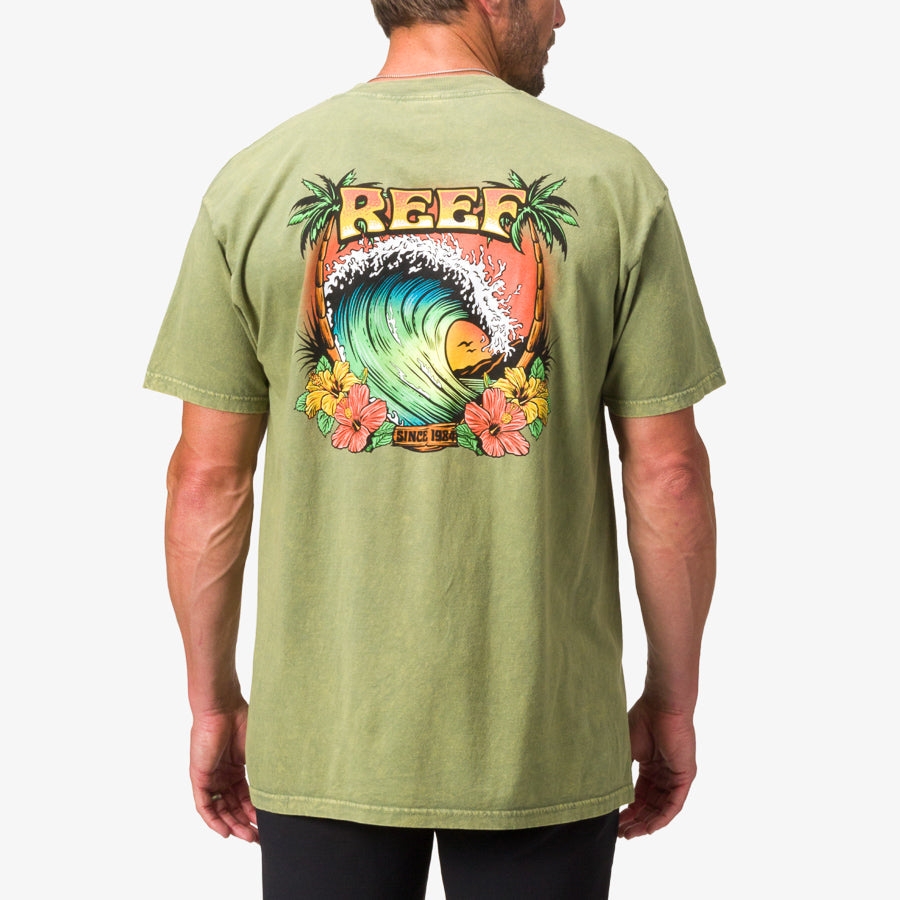 Man wearing the back of olive green Lonnie Tee with colorful surf-inspired REEF wave graphic and floral design