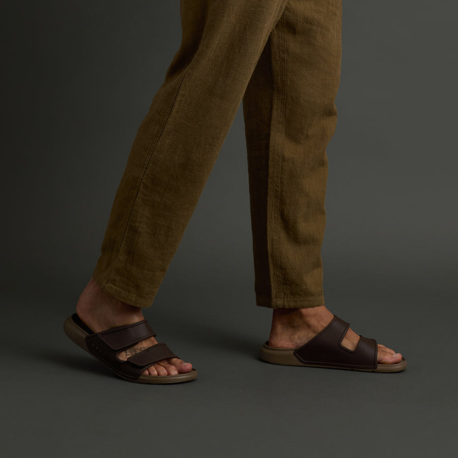 Oasis Adapt men's sandals in brown tan facing right, showing side view with comfort cushioning and arch support.