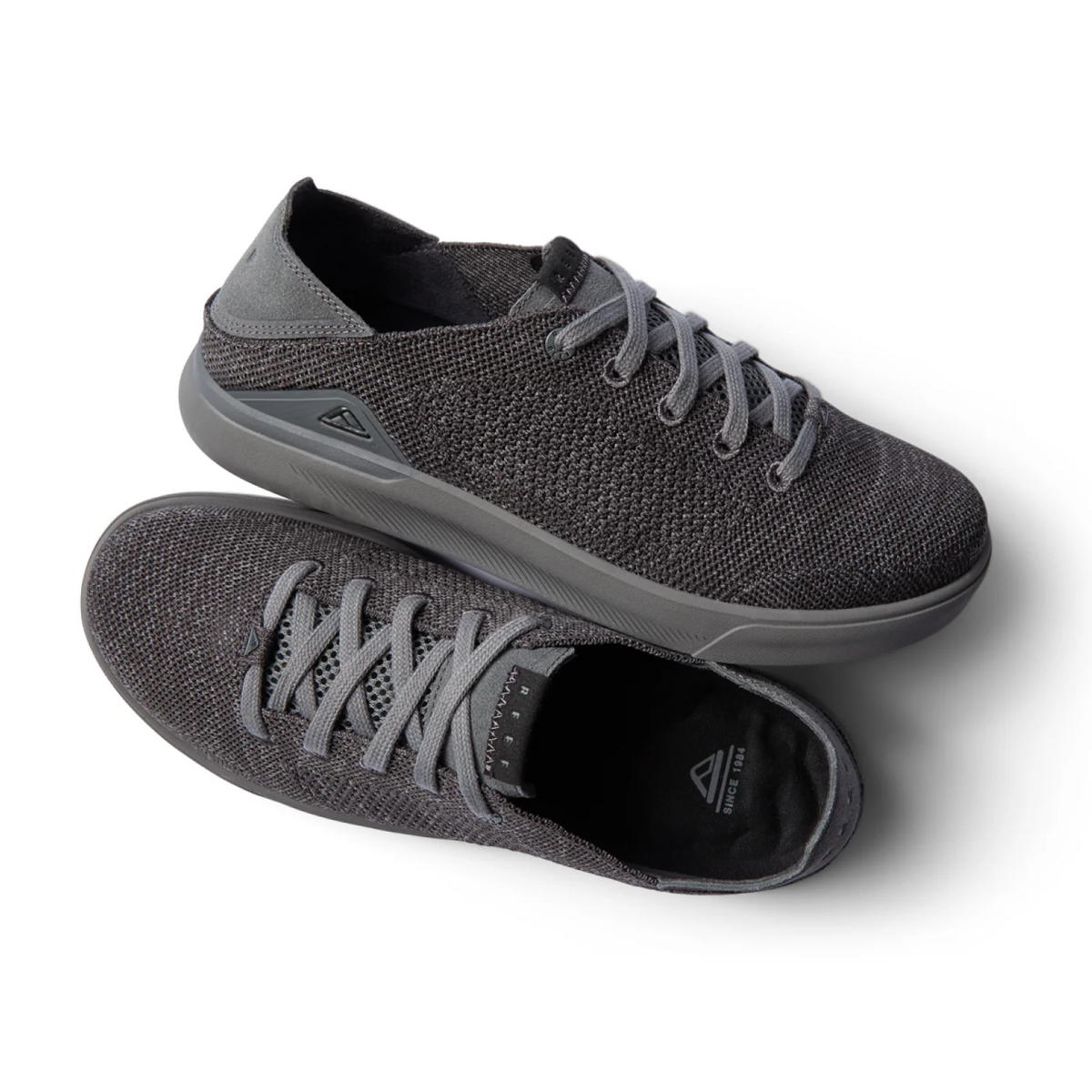 Neptune HT men's black sneaker pair with lightweight breathable knit upper, REEFlex cushioning, and anatomical arch support.