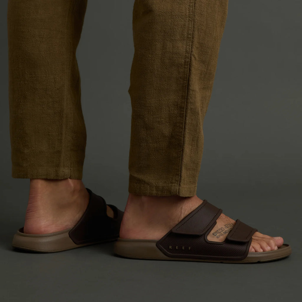 Oasis Adapt sandal in brown facing left, showing side and top with adjustable straps and arch support for comfort.
