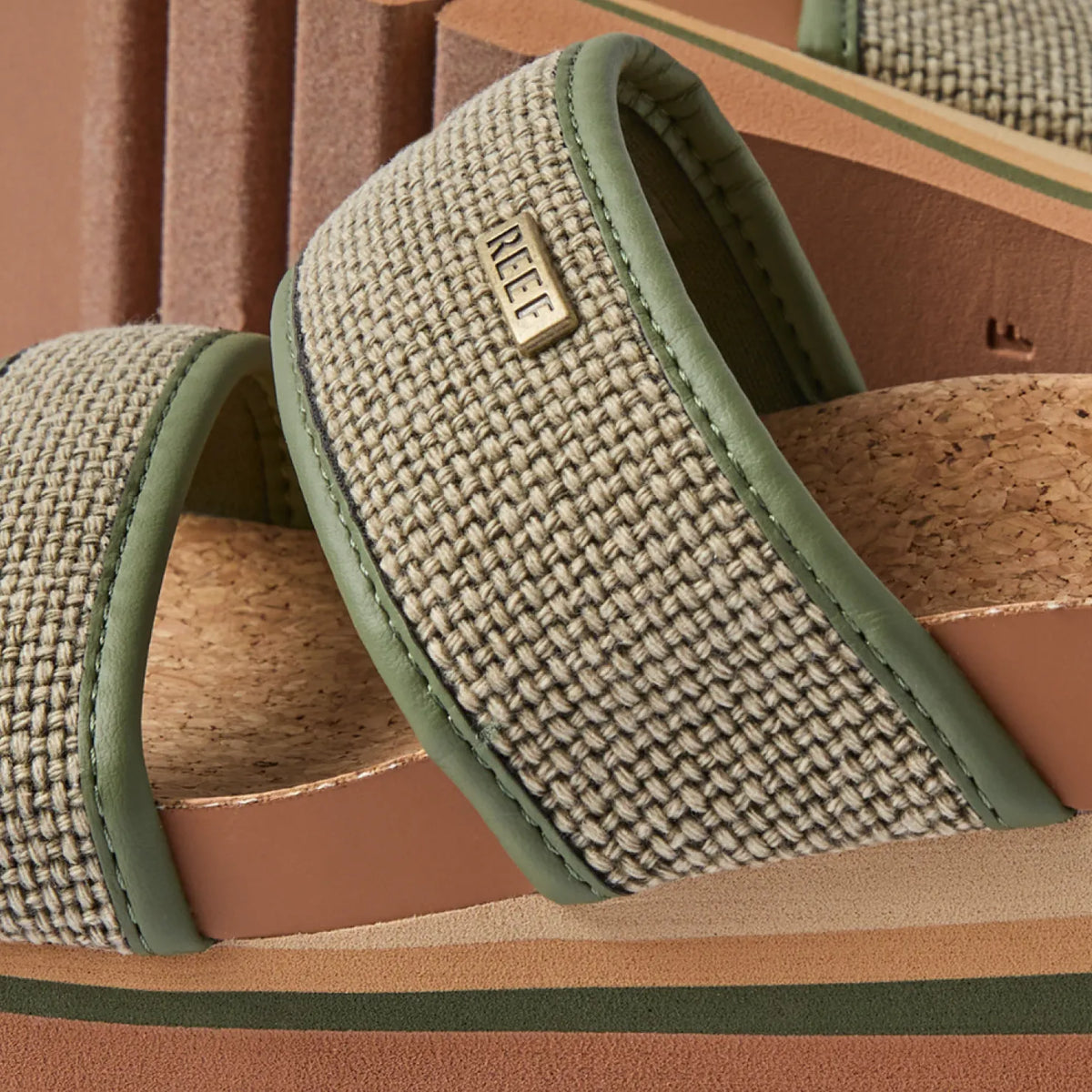 Close-up of Cushion Vista Higher sandal strap facing left with woven texture and anatomical arch support in neutral tones