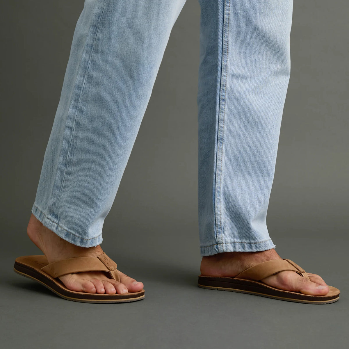 Ojai Classic tan sandals on feet facing right, showing soft-rebound cushioning and anatomical arch support for comfort.