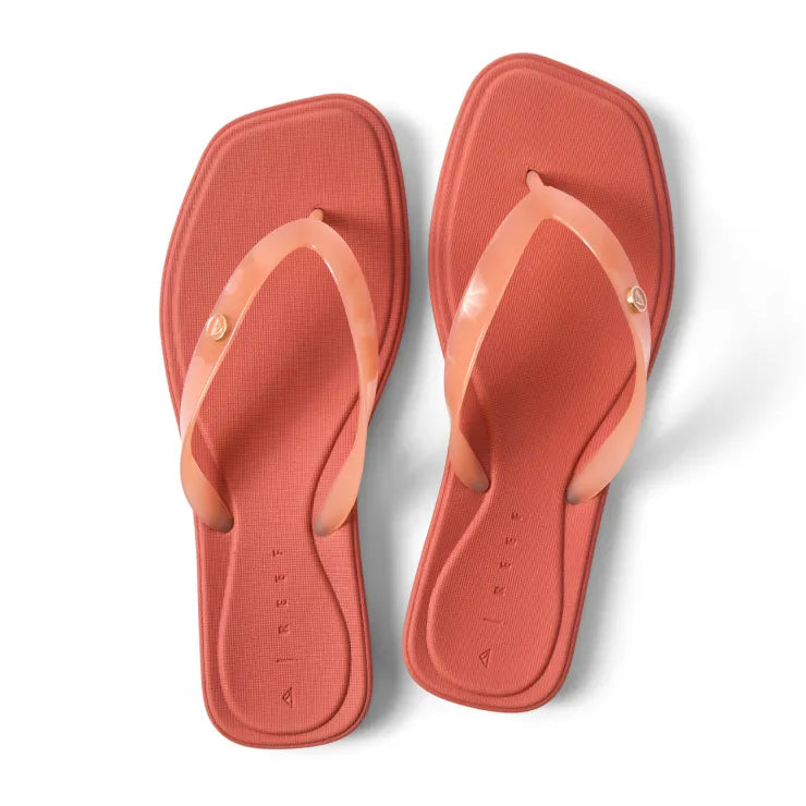 Top view of women's Solaye flip-flops in canyon sunset, square toe with sleek jelly straps, lightweight and water-friendly design.
