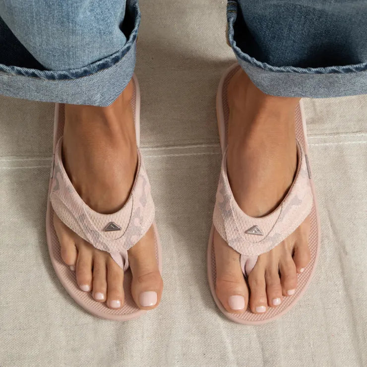 Fanning sandals facing forward, soft suede pink camo, close-up of top view showcasing arch support and comfort design.