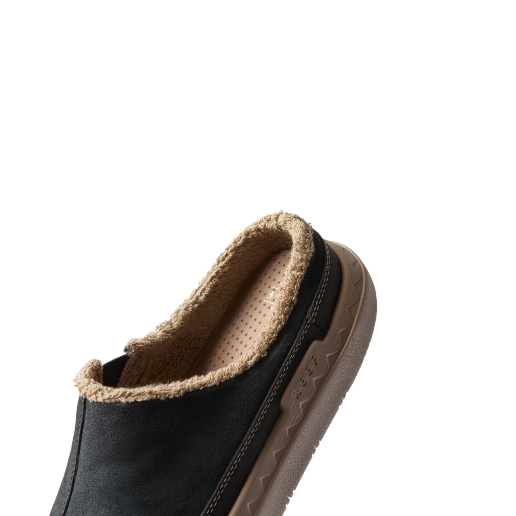 Rambler Mule facing right, close-up of heel with fleece lining showcasing comfort and durable design.