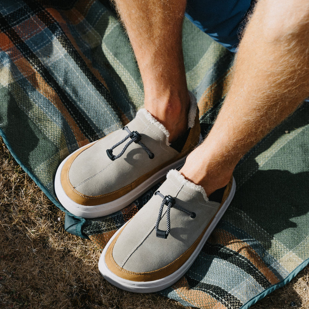 Rambler shoes viewed from above, toes facing lower left, close-up of suede uppers and cushioned outsoles