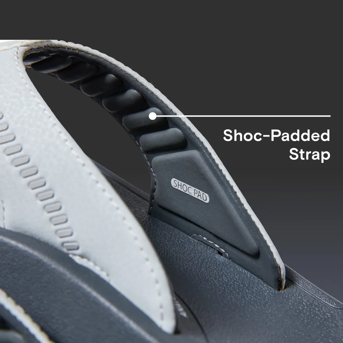 Close-up of the Cruiser sandal’s shock-padded strap showing soft-rebound cushioning for all-day beach comfort