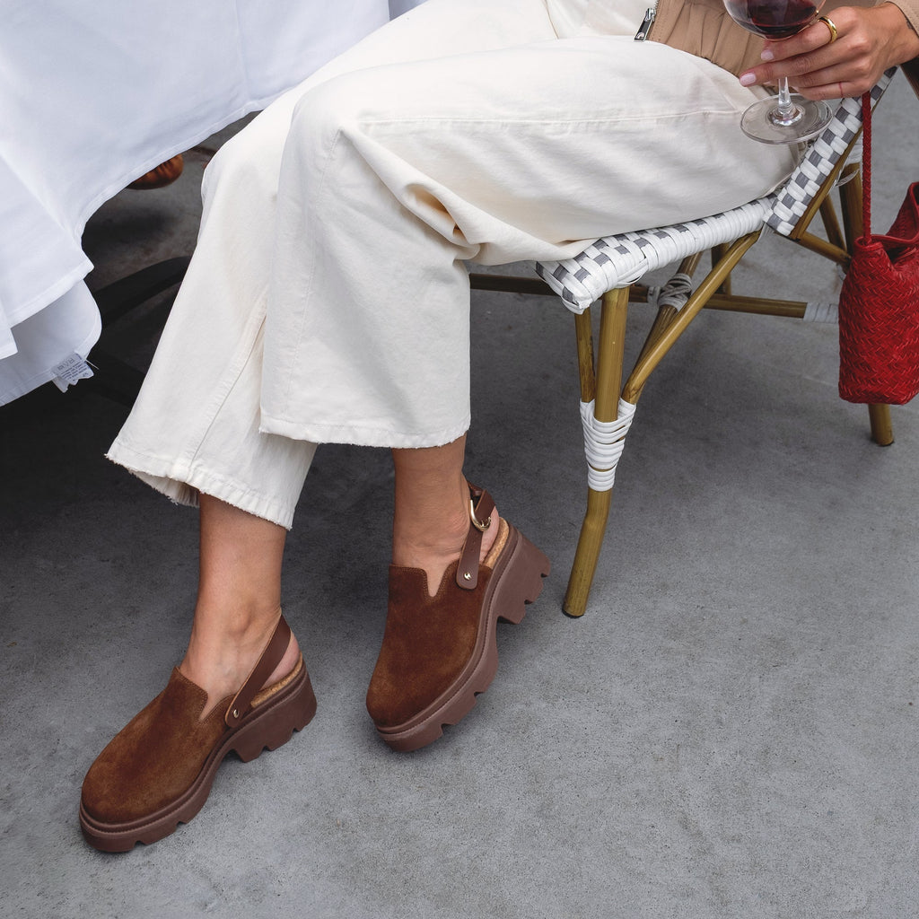 Vista Luxe Solene platform clogs facing right, close-up on side and top of brown suede women's shoes with arch support.