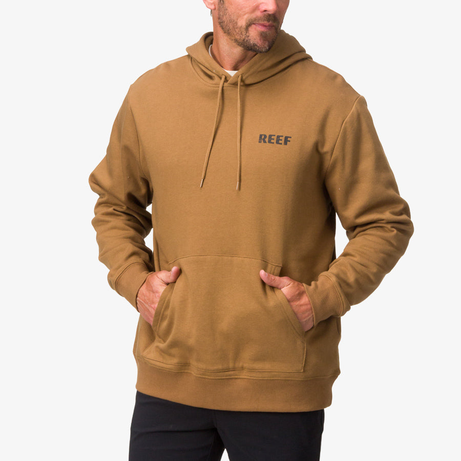 Front view of a man wearing the Wellie Too Hoodie in brown, featuring soft-rebound cushioning and arch support for beach comfort.