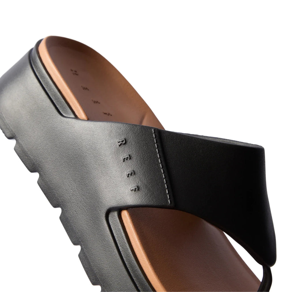 Cali Laguna black platform sandal close-up on right side strap and cushioned molded footbed with anatomical arch support